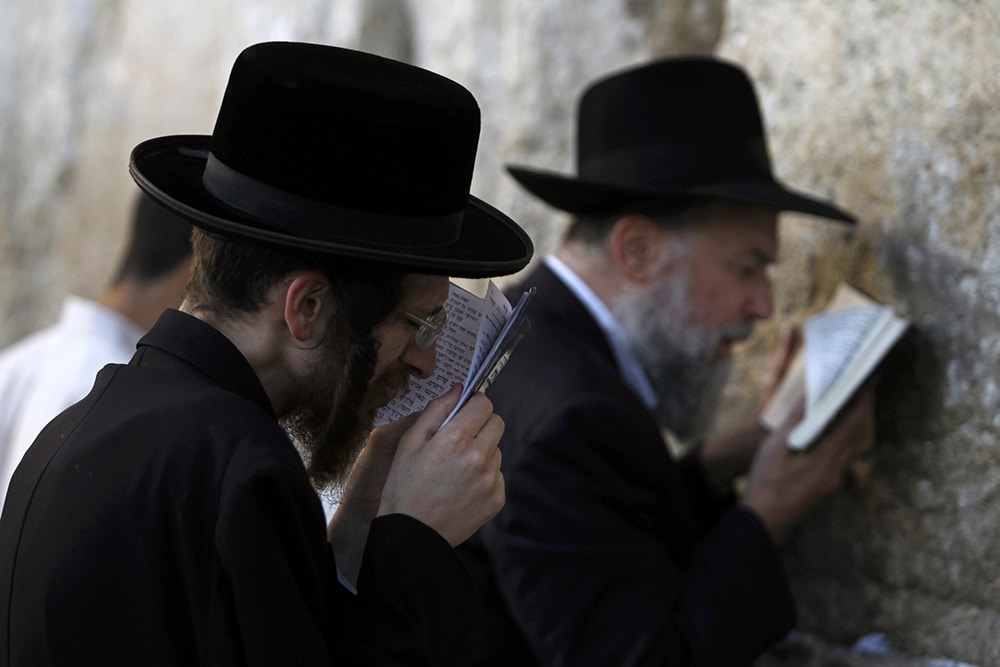 JEWISH WORSHIPPERS PRAY AT WESTERN WALL IN JERUSALEM