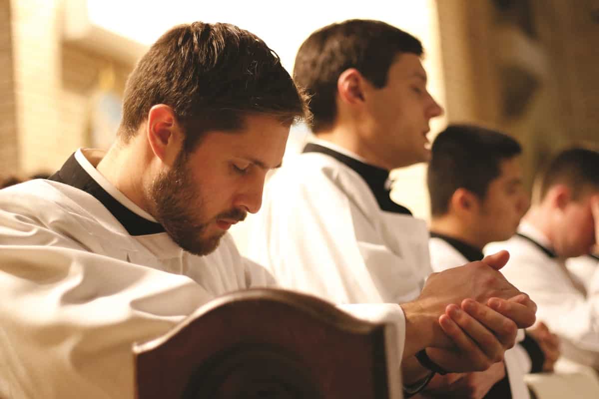 A seminarian prays during a Holy Hour for vocations (CNS photo/Gregory A. Shemitz, Long Island Catholic)