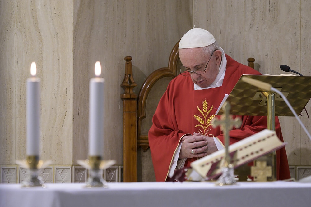 Pope Francis prays