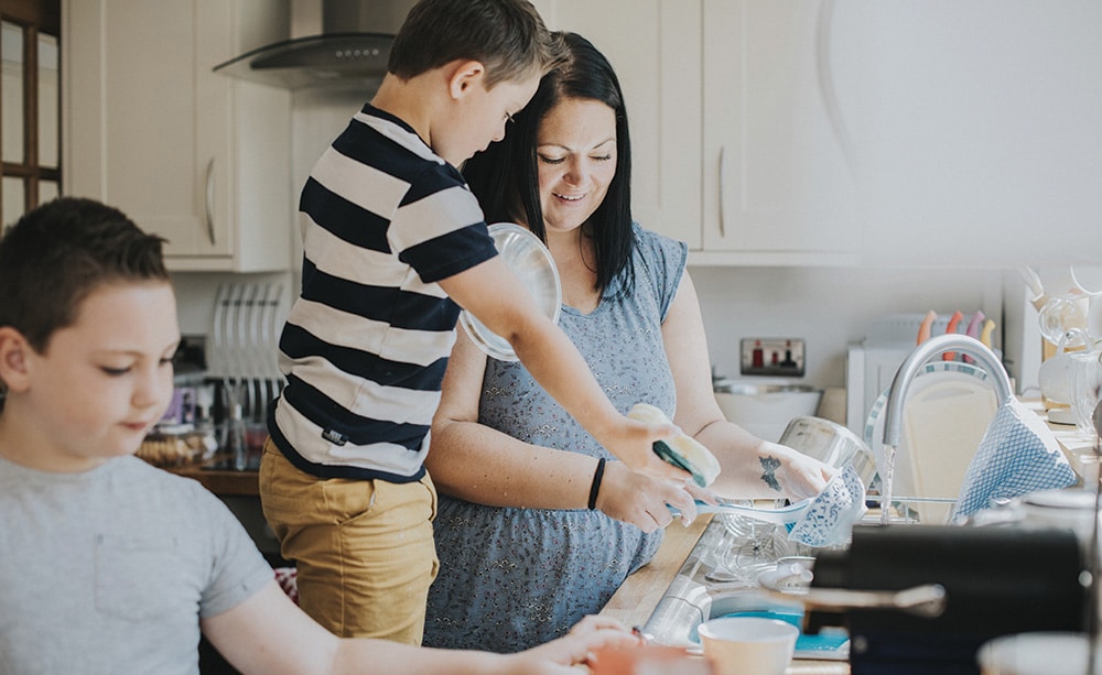 Family cleaning in the kitchen