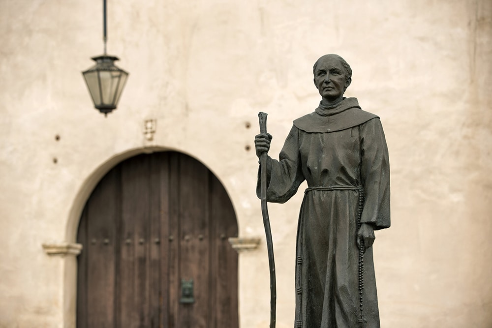 Statue of Blessed Junipero Serra stands outside San Gabriel Mission in California