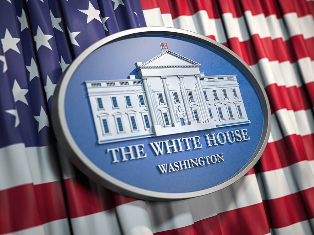 The White House Washington sign on flag of United States USA.