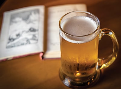 mug of beer and book