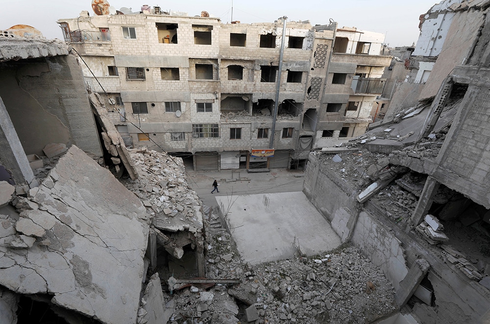 SYRIA BOY DAMAGED BUILDINGS