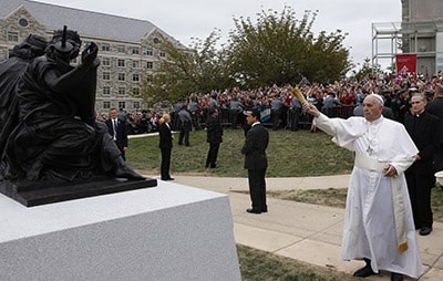 Pope Francis blesses a sculpture