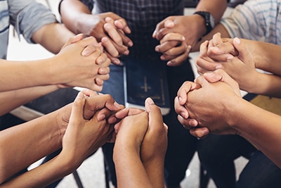 group holding hands