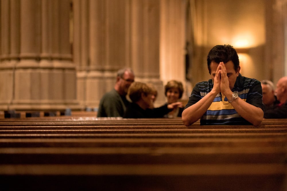 talking at Mass