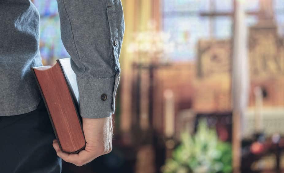 man holding bible