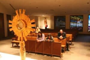 People in a chapel praying during Eucharistic adoration