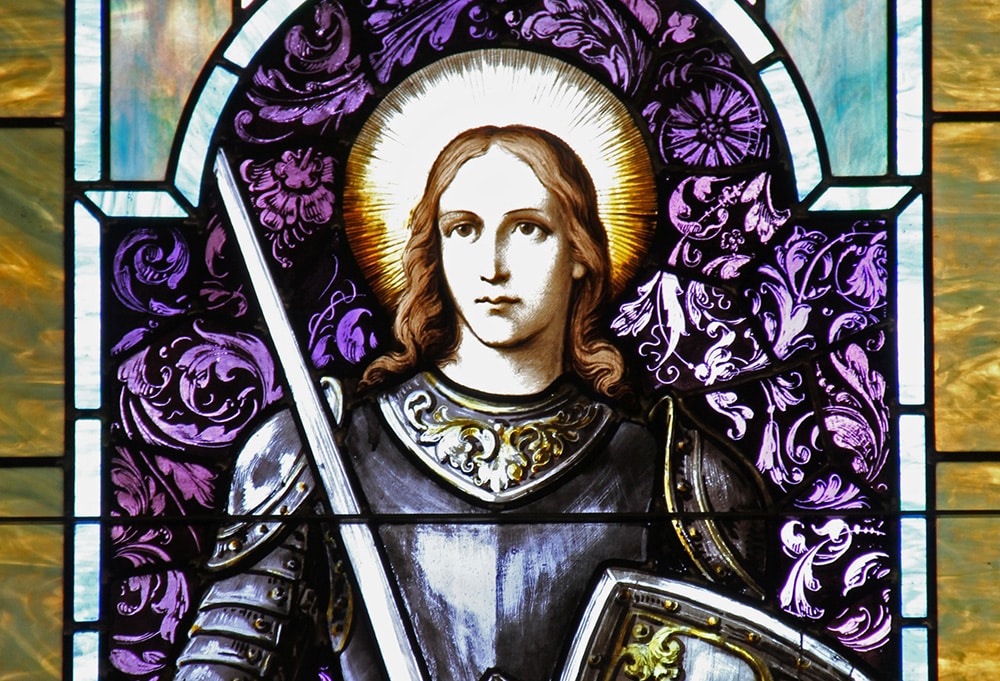 Stained glass image of St. Joan of Arc.
