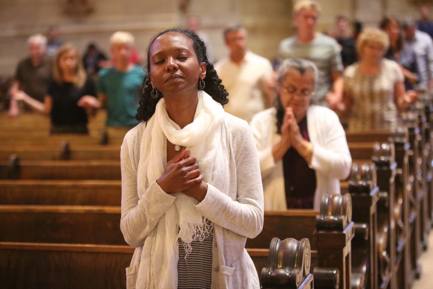 A woman prays at the Cathedral of St. Paul in Minnesota.