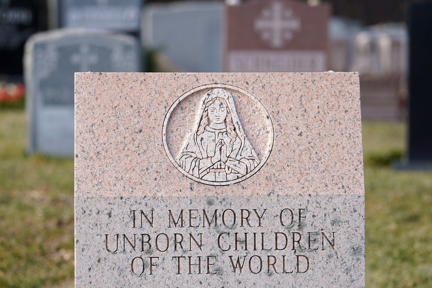 A memorial stone dedicated to the unborn children of the world is seen at St. Patrick Parish Cemetery in Smithtown N.Y.