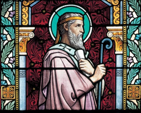 A stained glass image of St. Irenaeus