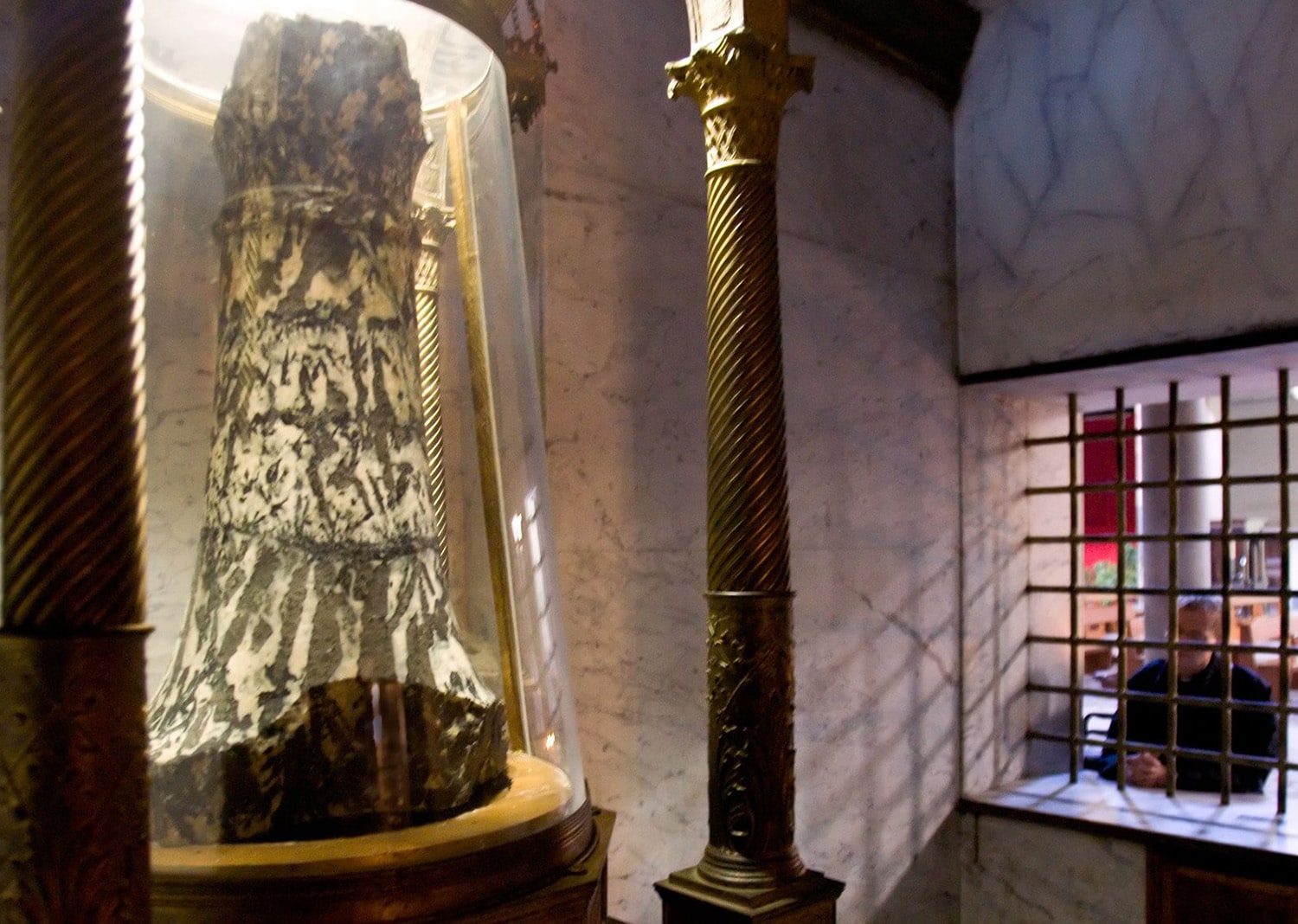 PRIEST PRAYS AT THE PILLAR OF FLAGELLATION IN ROME