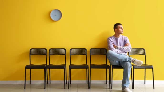 Man seated waiting